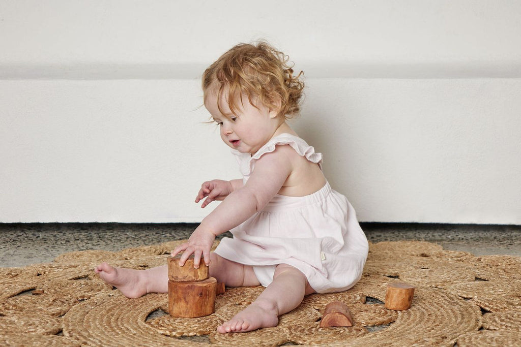 Baby in Tiny Twig organic cotton